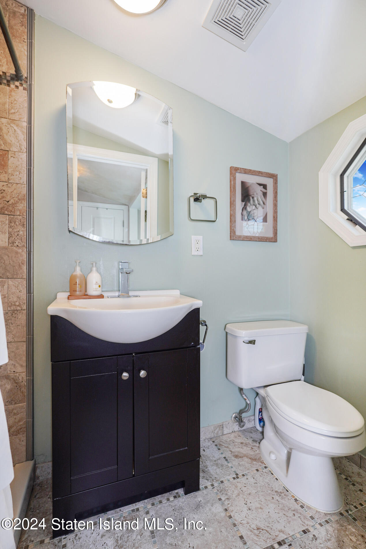 38 Milbank Road Staten Island, NY 10306 - Photo 24 of 30 a bathroom with a toilet a sink and mirror