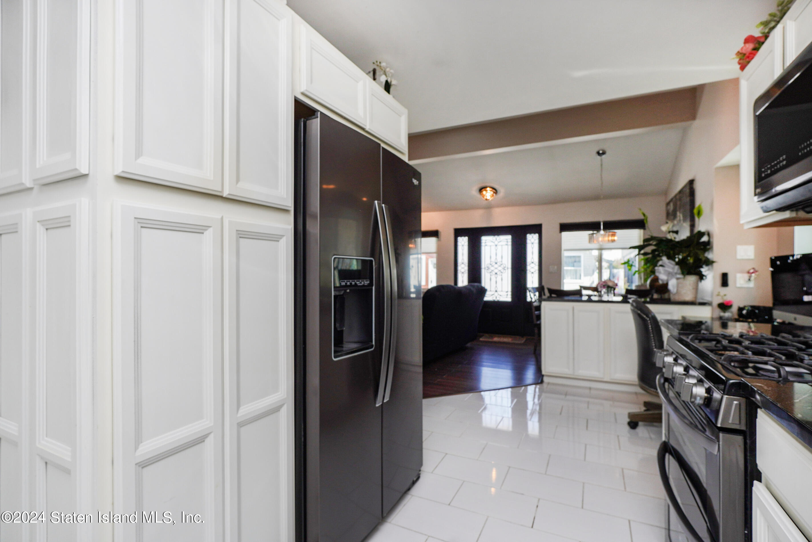 38 Milbank Road Staten Island, NY 10306 - Photo 6 of 30 a kitchen with stainless steel appliances granite countertop a refrigerator and a stove