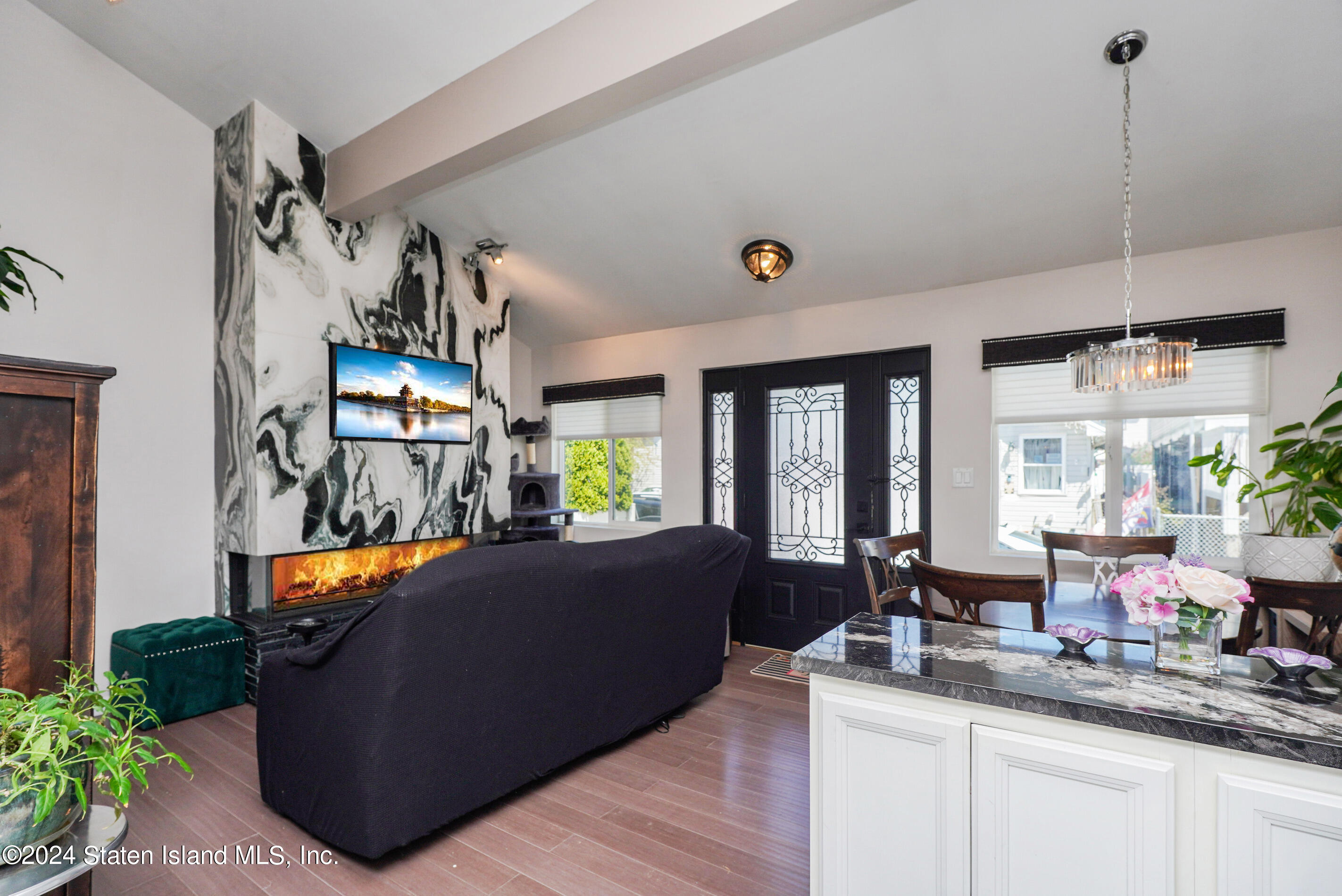 38 Milbank Road Staten Island, NY 10306 - Photo 9 of 30 a living room with furniture and a flat screen tv