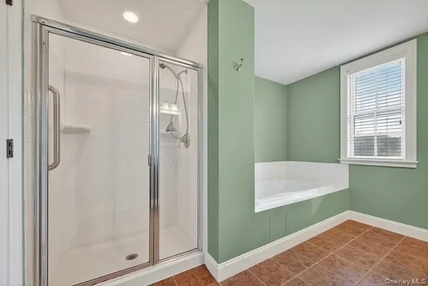 a bathroom with a shower and a sink