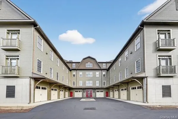 a view of a large building with a small yard