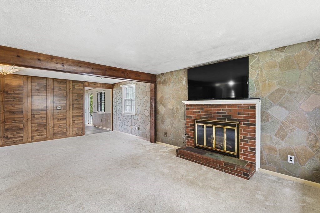10 Fitzpatrick Avenue Brockton, MA 02301 - Photo 11 of 34 a view of empty room with fireplace and flat screen tv