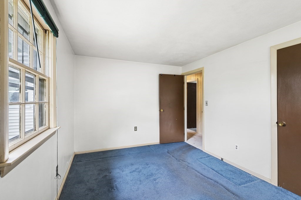 10 Fitzpatrick Avenue Brockton, MA 02301 - Photo 16 of 34 a view of an empty room with wooden floor and windows
