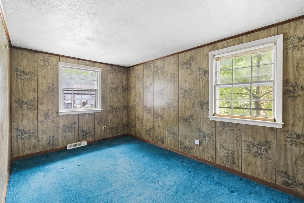 10 Fitzpatrick Avenue Brockton, MA 02301 - Photo 20 of 34 a view of an empty room with hardwood and a window