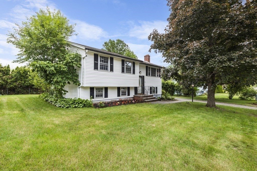 10 Fitzpatrick Avenue Brockton, MA 02301 - Photo 2 of 34 a house that is sitting in the grass
