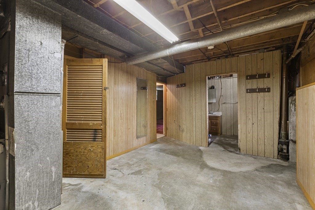 10 Fitzpatrick Avenue Brockton, MA 02301 - Photo 27 of 34 a view of a hallway with wooden walls