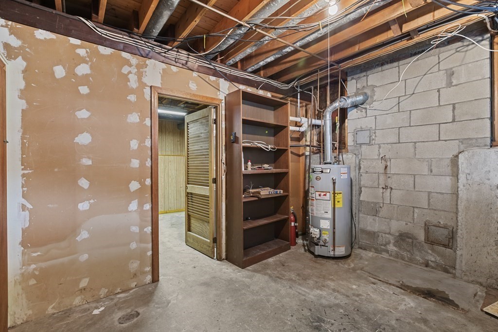 10 Fitzpatrick Avenue Brockton, MA 02301 - Photo 29 of 34 a view of an empty room with storage and a shower