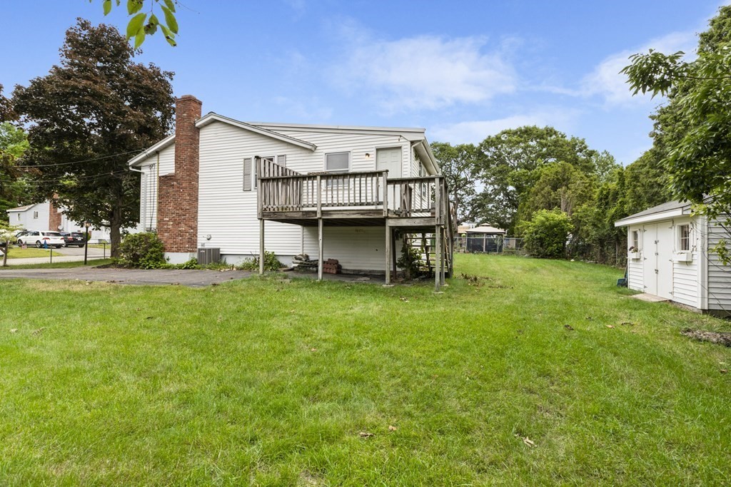 10 Fitzpatrick Avenue Brockton, MA 02301 - Photo 30 of 34 a view of a house with backyard and a tree