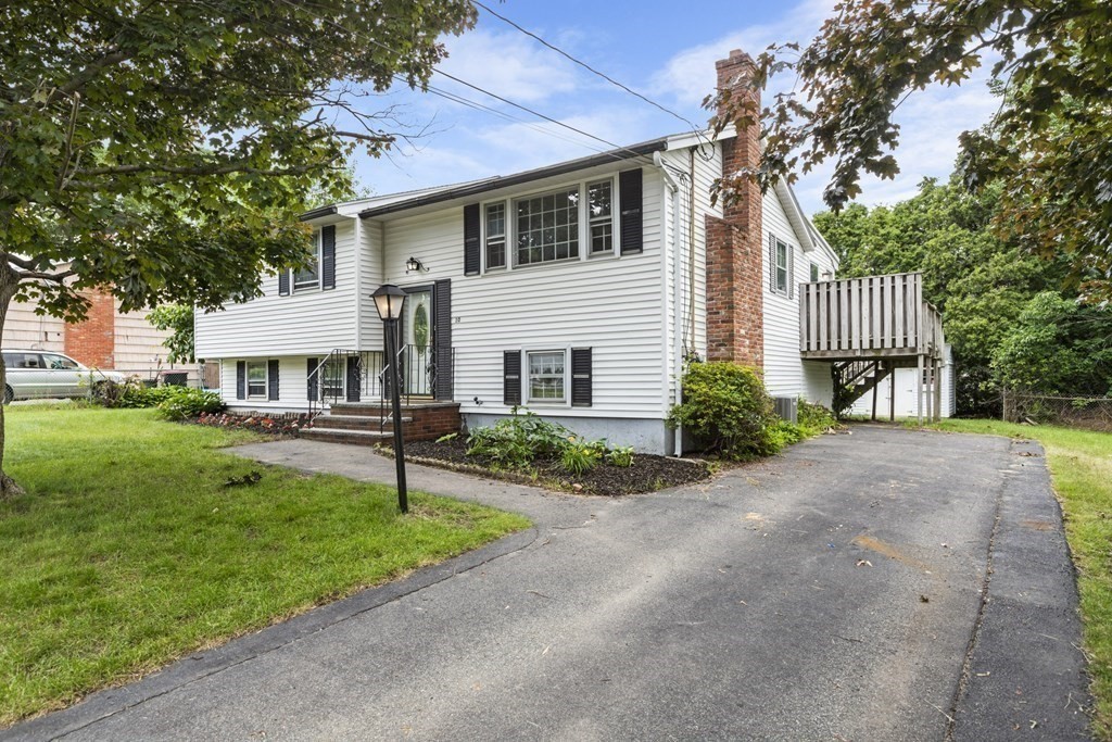 10 Fitzpatrick Avenue Brockton, MA 02301 - Photo 34 of 34 a front view of a house with a garden and trees