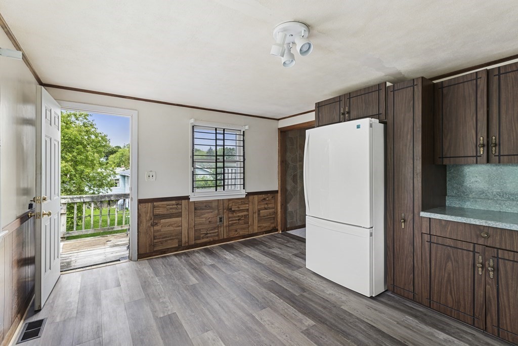 10 Fitzpatrick Avenue Brockton, MA 02301 - Photo 6 of 34 a kitchen with stainless steel appliances a refrigerator and wooden floors