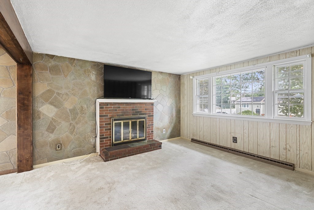 10 Fitzpatrick Avenue Brockton, MA 02301 - Photo 10 of 34 a view of livingroom with an empty space and a fireplace
