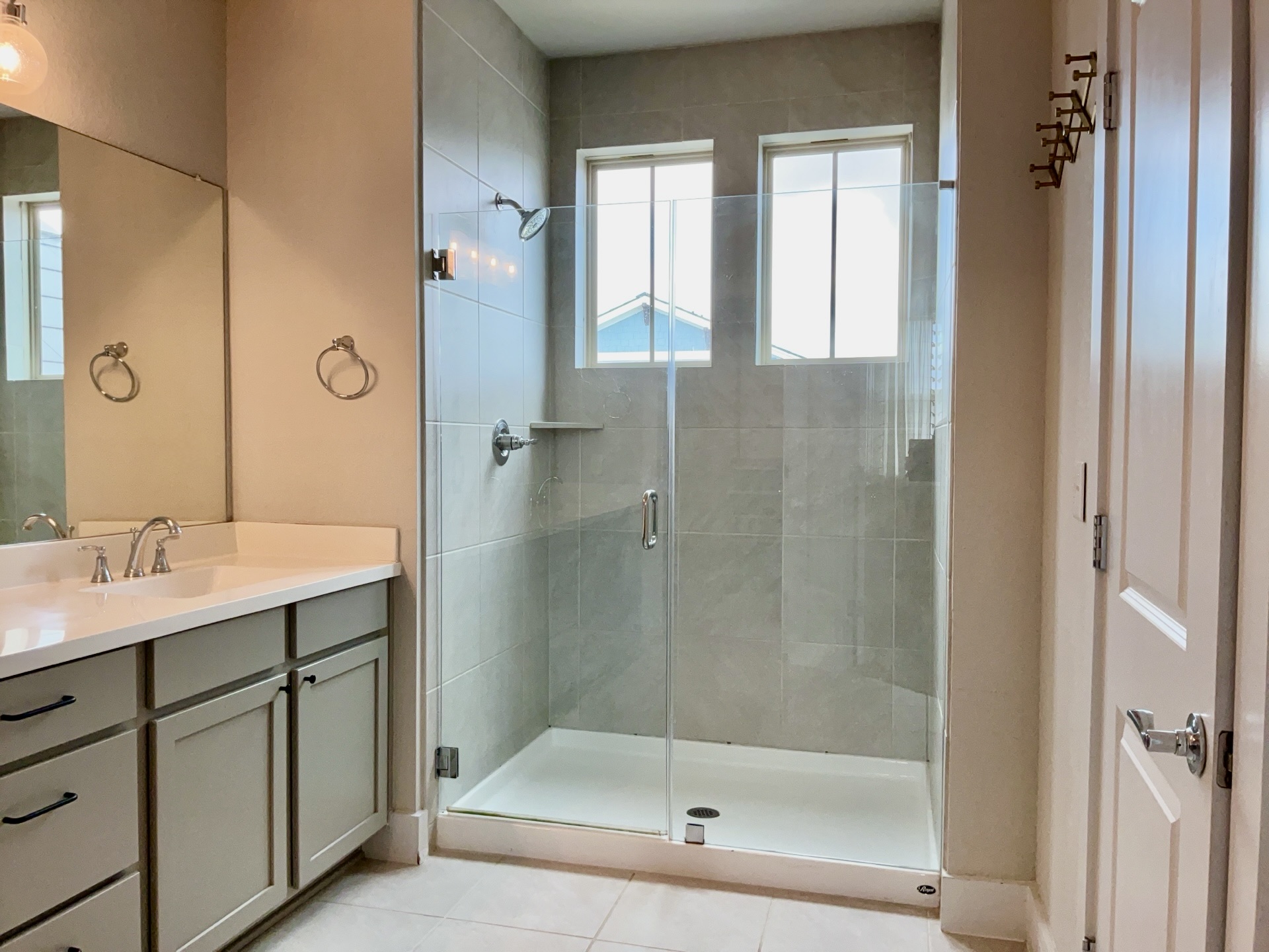 8315 Laughlin Lane Austin, TX 78744 - Photo 12 of 23 Bathroom with vanity, a shower stall, and light tile patterned floors