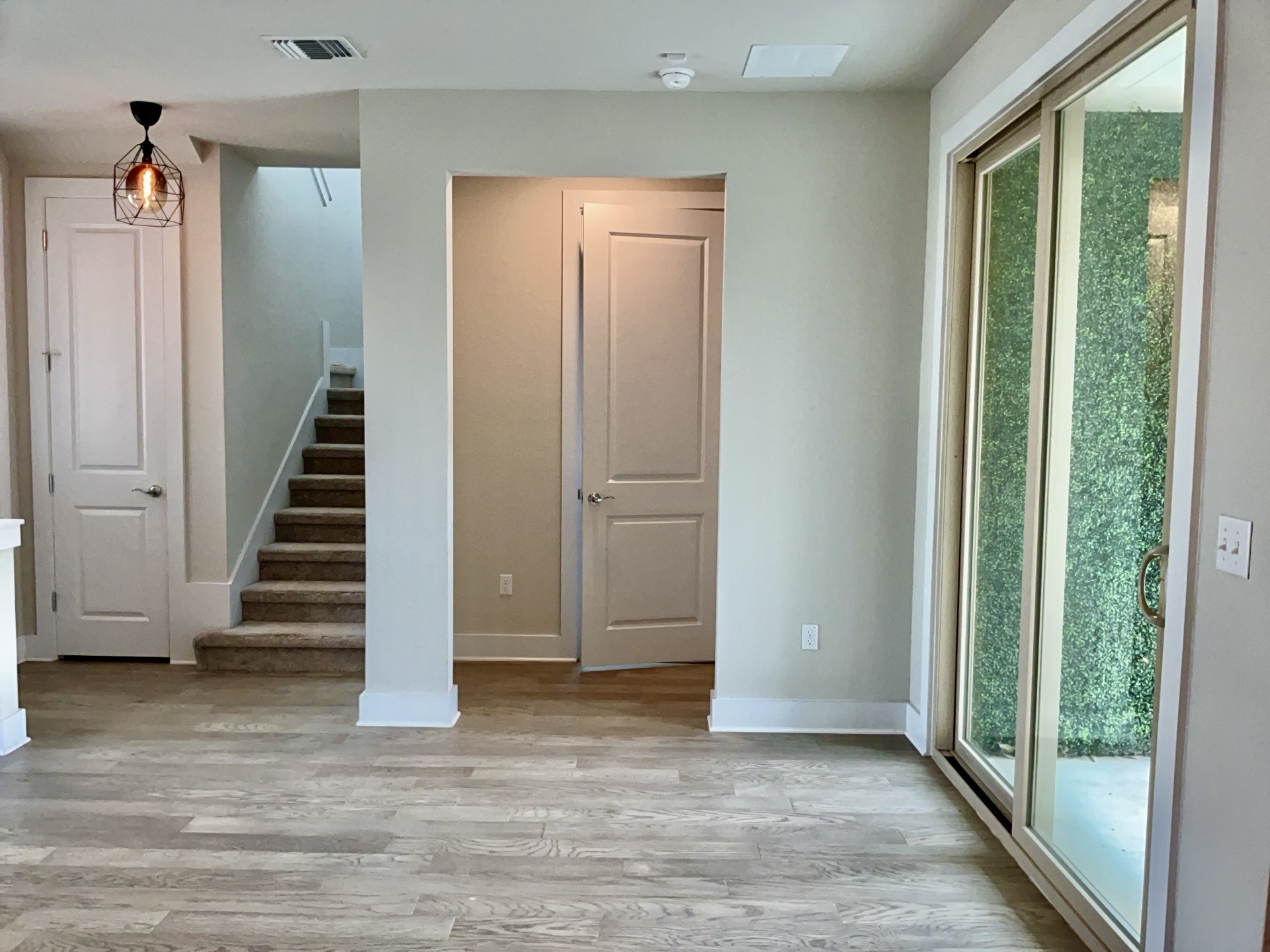 8315 Laughlin Lane Austin, TX 78744 - Photo 7 of 23 Dining Room with wood finished floors, ceiling fan, built in desk, and recessed lighting