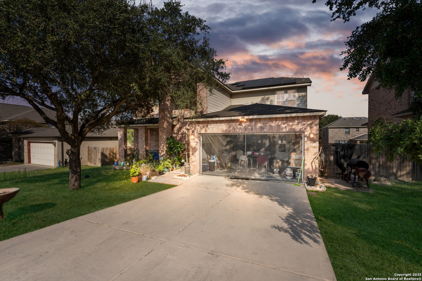 144 Springtree Bluff Cibolo, TX 78108 - Photo 1 of 37 a front view of a house with a yard and garage