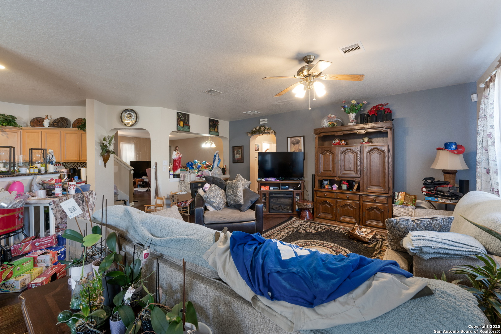 144 Springtree Bluff Cibolo, TX 78108 - Photo 11 of 37 a living room with furniture and a flat screen tv