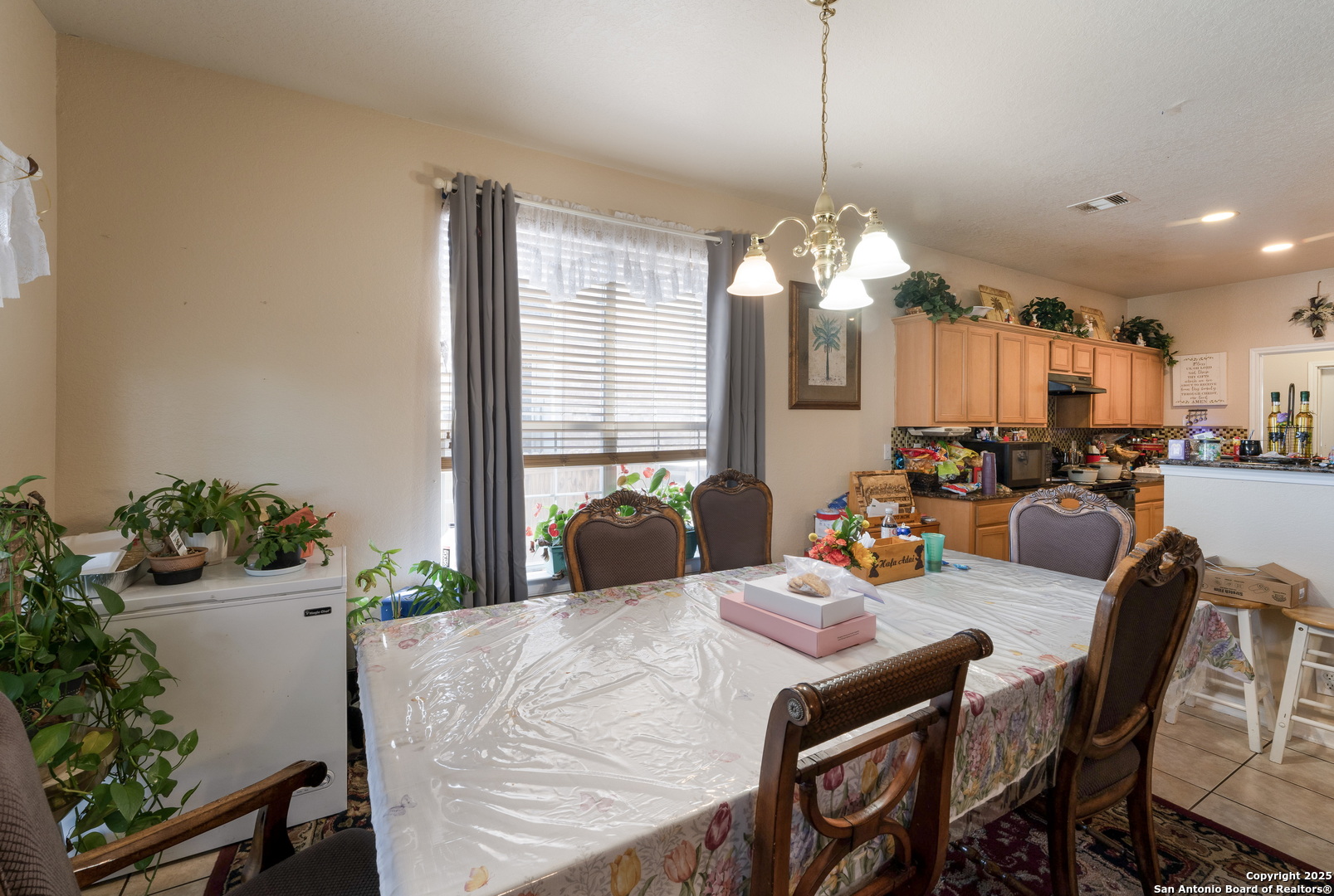 144 Springtree Bluff Cibolo, TX 78108 - Photo 12 of 37 a very nice looking dining room with furniture window and wooden floor
