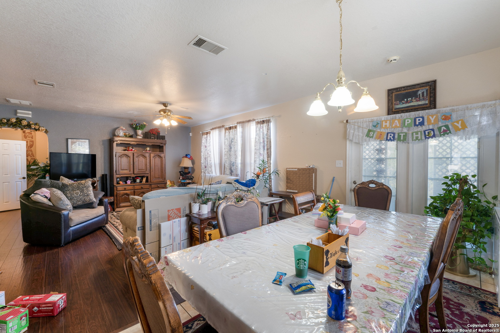 144 Springtree Bluff Cibolo, TX 78108 - Photo 13 of 37 a view of a dining room with furniture window and wooden floor