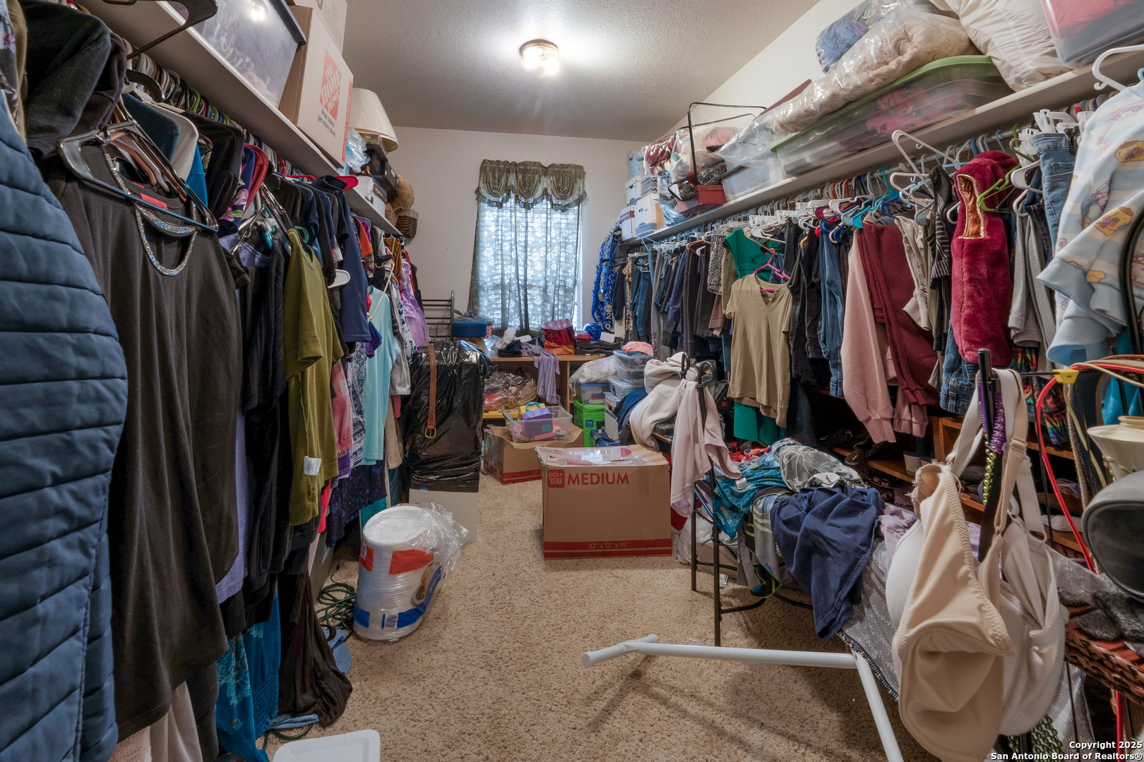 144 Springtree Bluff Cibolo, TX 78108 - Photo 20 of 37 a view of walk in closet with clothes and shoes