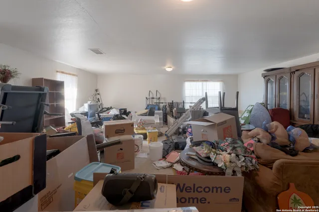 a living room with lots of furniture and a flat screen tv