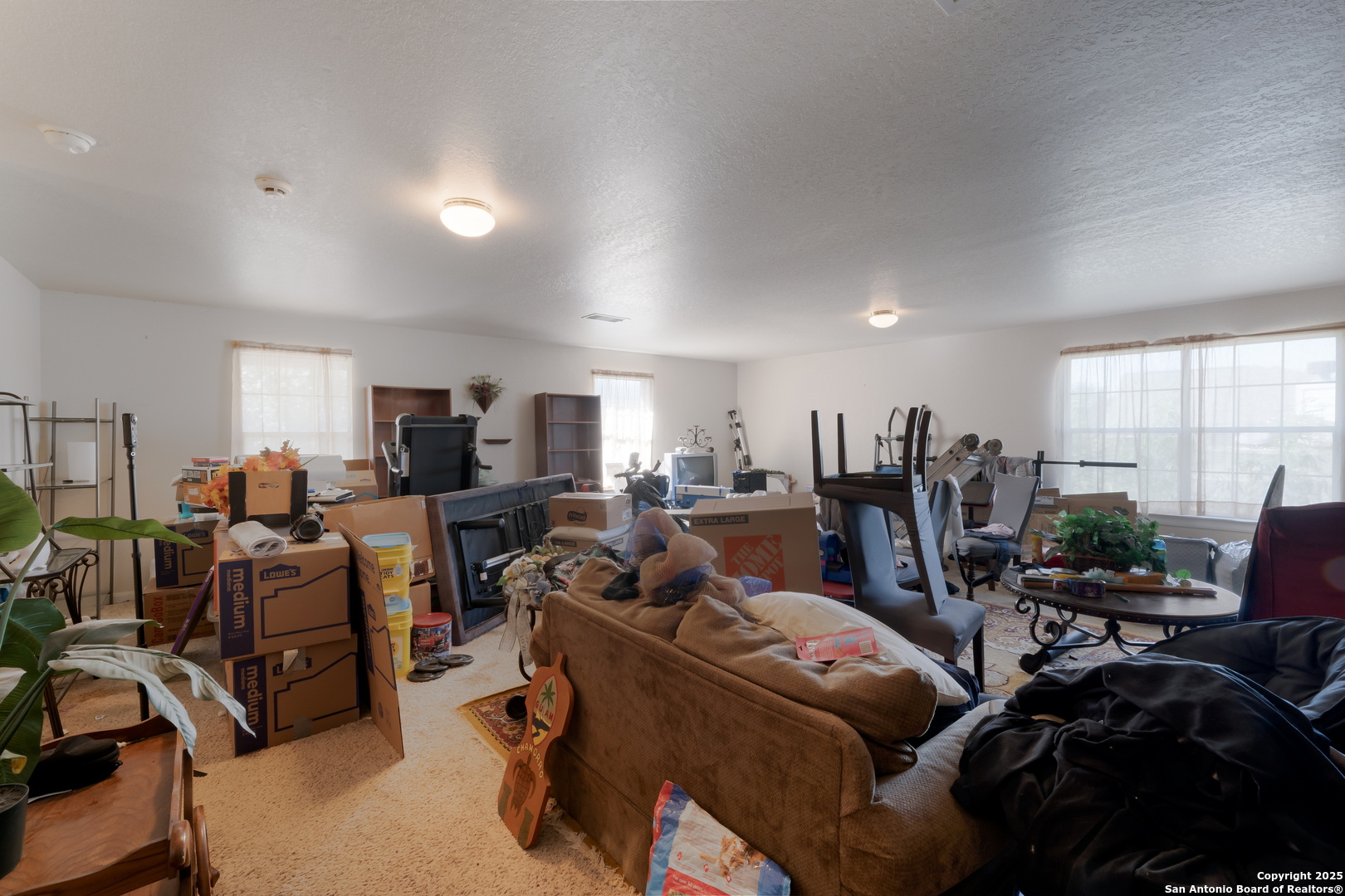 144 Springtree Bluff Cibolo, TX 78108 - Photo 22 of 37 a living room with furniture kitchen view and a flat screen tv
