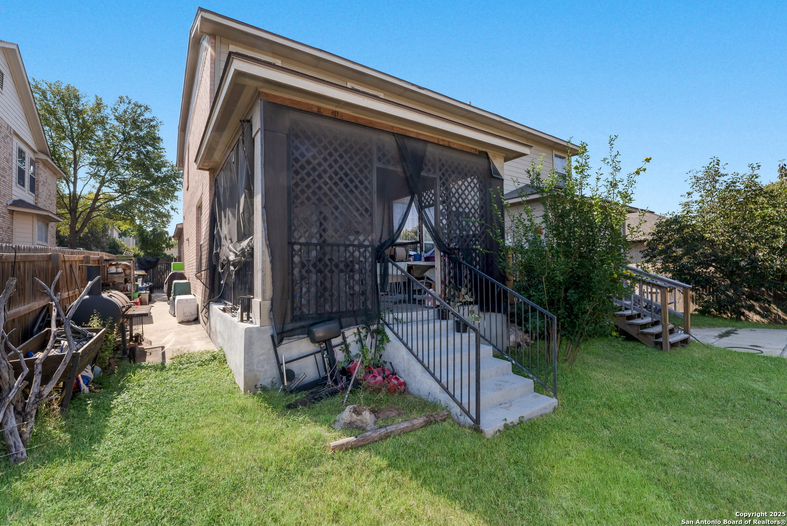 144 Springtree Bluff Cibolo, TX 78108 - Photo 34 of 37 a view of a backyard with plants and a slide