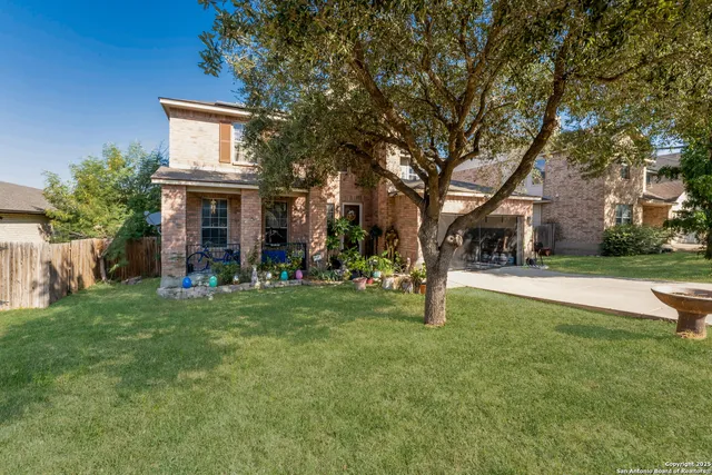 a view of house with outdoor space and garden