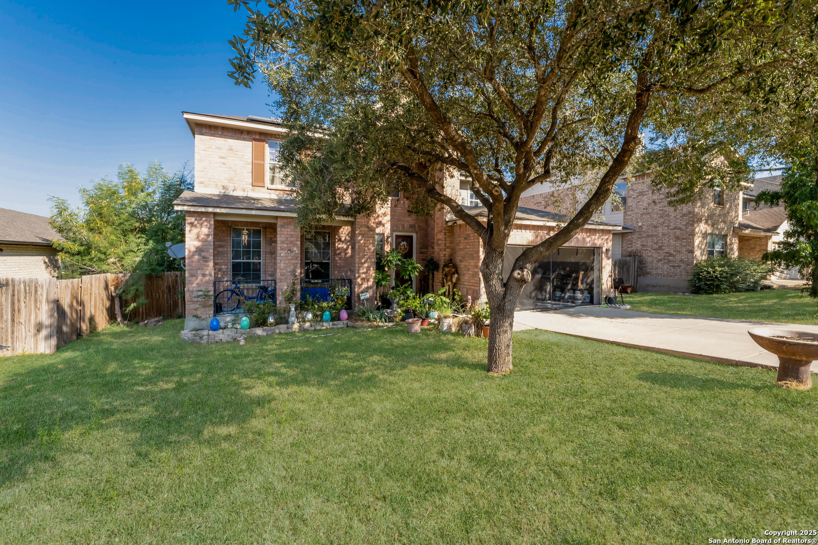 144 Springtree Bluff Cibolo, TX 78108 - Photo 4 of 37 a view of house with outdoor space and garden