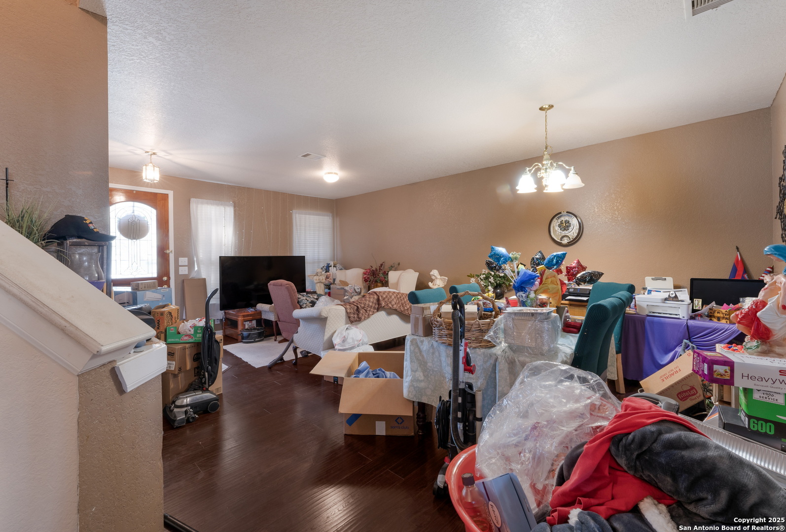 144 Springtree Bluff Cibolo, TX 78108 - Photo 9 of 37 a living room with lots of furniture and a chandelier