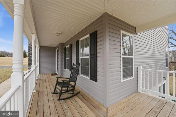 a view of a two chairs in the balcony