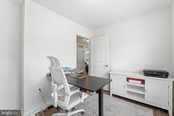 a view of a workspace with furniture