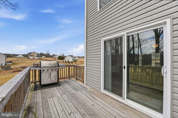 a view of a balcony with wooden floor
