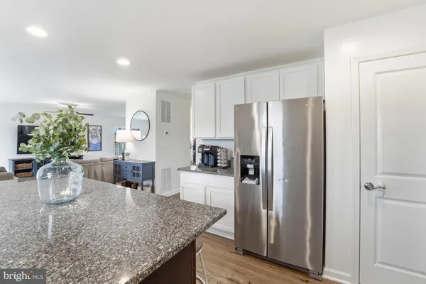 a kitchen with a refrigerator and microwave