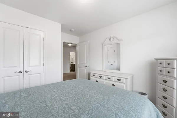 wooden floor with cabinet and mirror