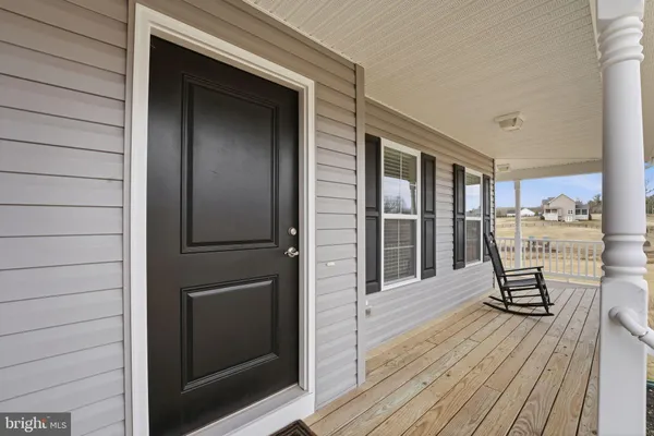 a balcony view with a seating space
