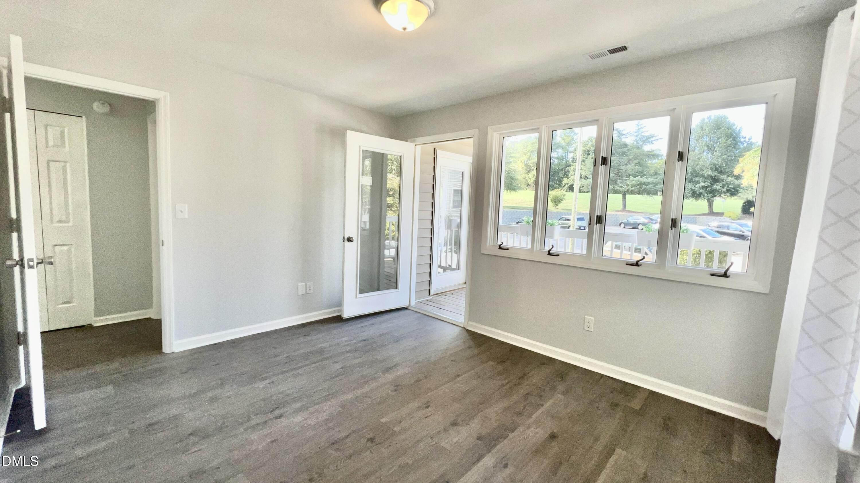 923 Springfork Drive Cary, NC 27513 - Photo 28 of 35 Enjoy all these Windows in the 2nd Bedroom! Access to Front Deck too!