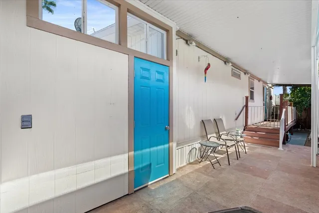 a view of a swimming pool and lounge chairs