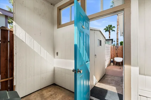 a view of a chairs and table in patio