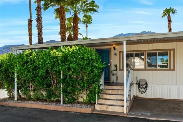 a view of a house with a tree