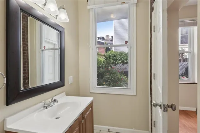 an empty room with wooden floor and closet