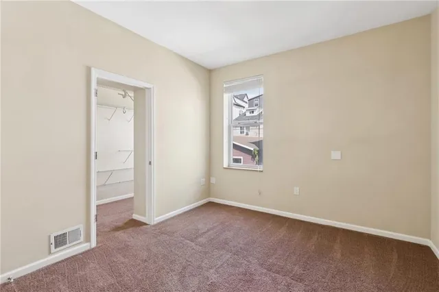 a view of an empty walk in closet