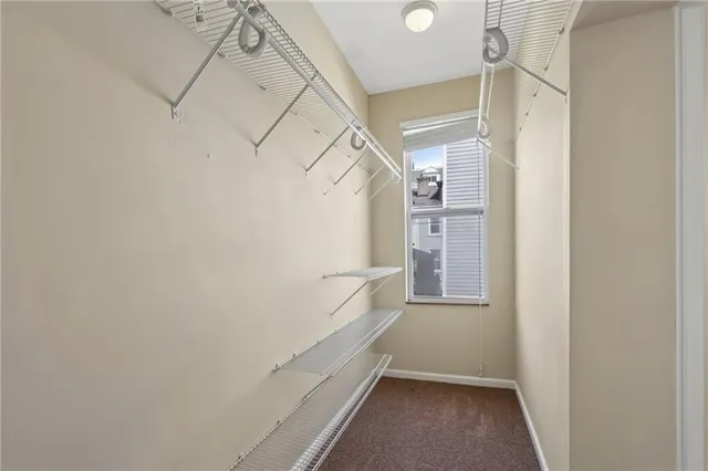 a close view of a utility room with dryer and washer