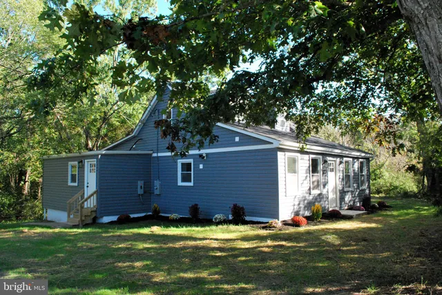 a view of hallway with wooden floor