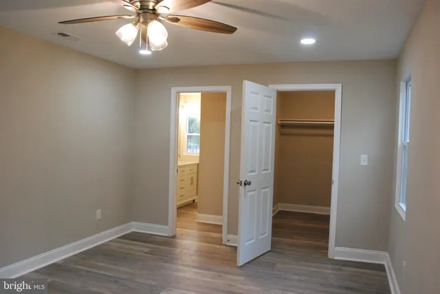 a bathroom with a sink mirror and a shower