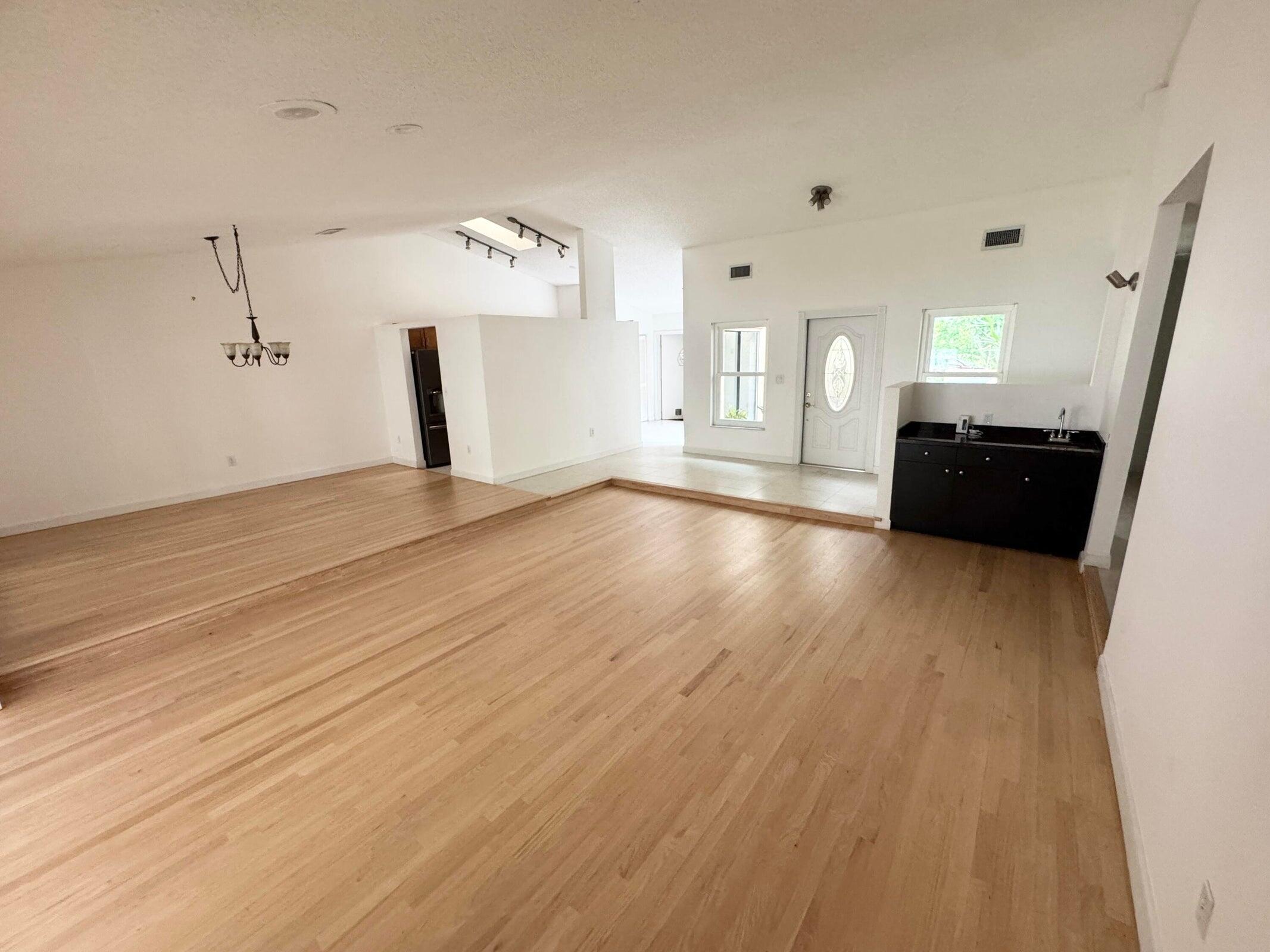 a view of a livingroom with wooden floor