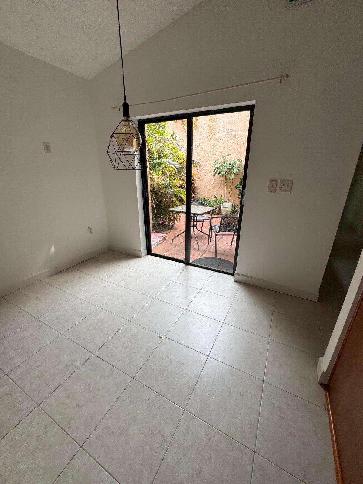 23261 Boca Club Colony Circle Boca Raton, FL 33433 - Photo 16 of 17 a view of an empty room with a window
