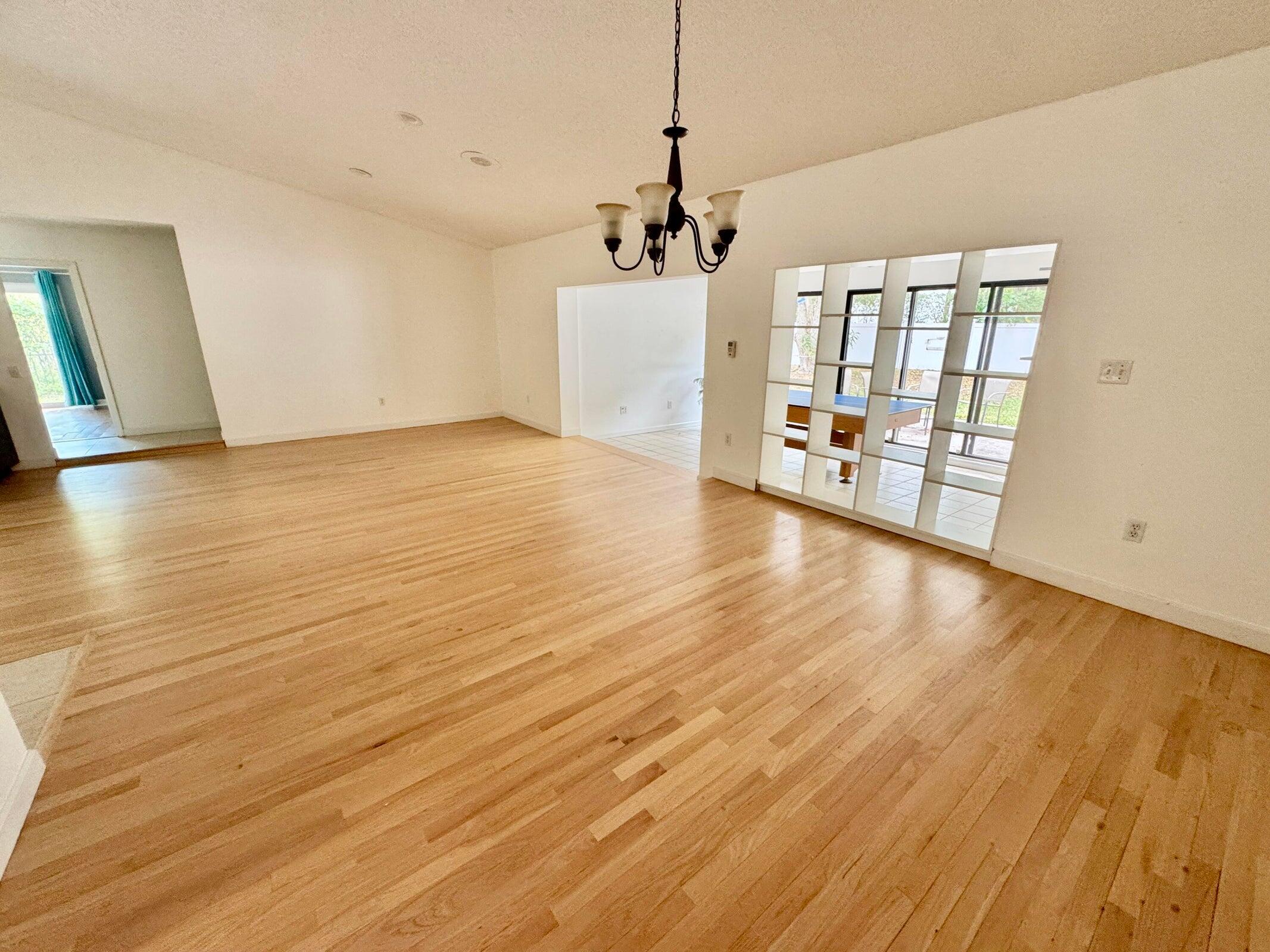 23261 Boca Club Colony Circle Boca Raton, FL 33433 - Photo 17 of 17 a view of an empty room with window and wooden floor