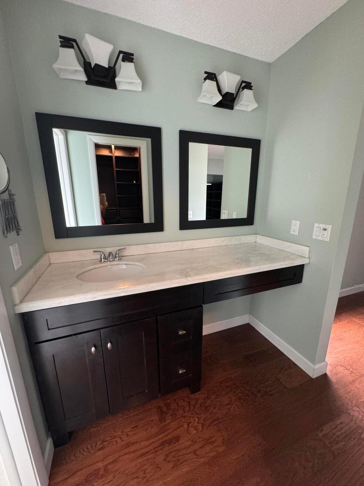 23261 Boca Club Colony Circle Boca Raton, FL 33433 - Photo 9 of 17 a bathroom with a sink and a mirror