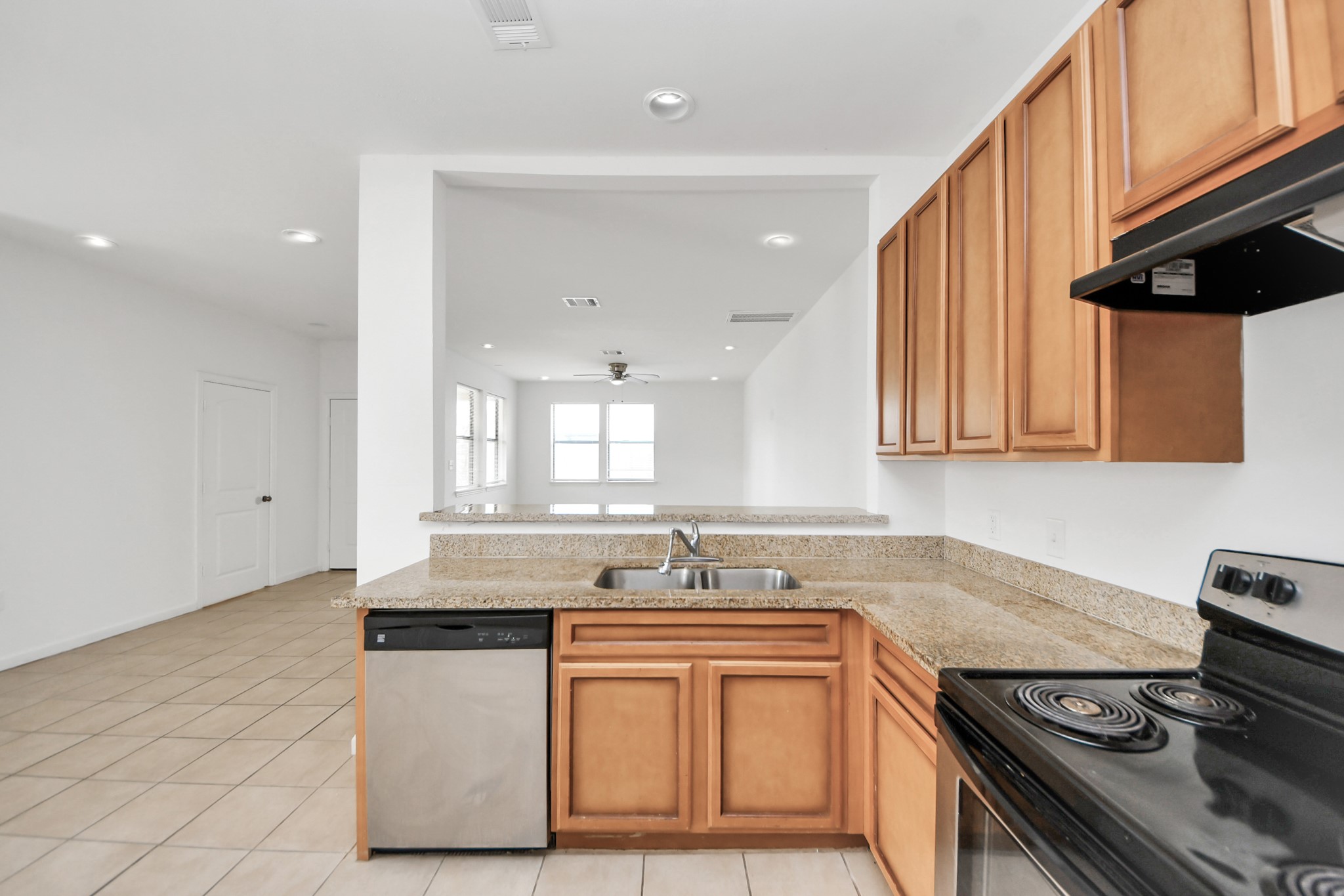 4327 Oak Ridge Drive, Unit A Pasadena, TX 77503 - Photo 5 of 20 a kitchen with stainless steel appliances granite countertop a sink stove and cabinets