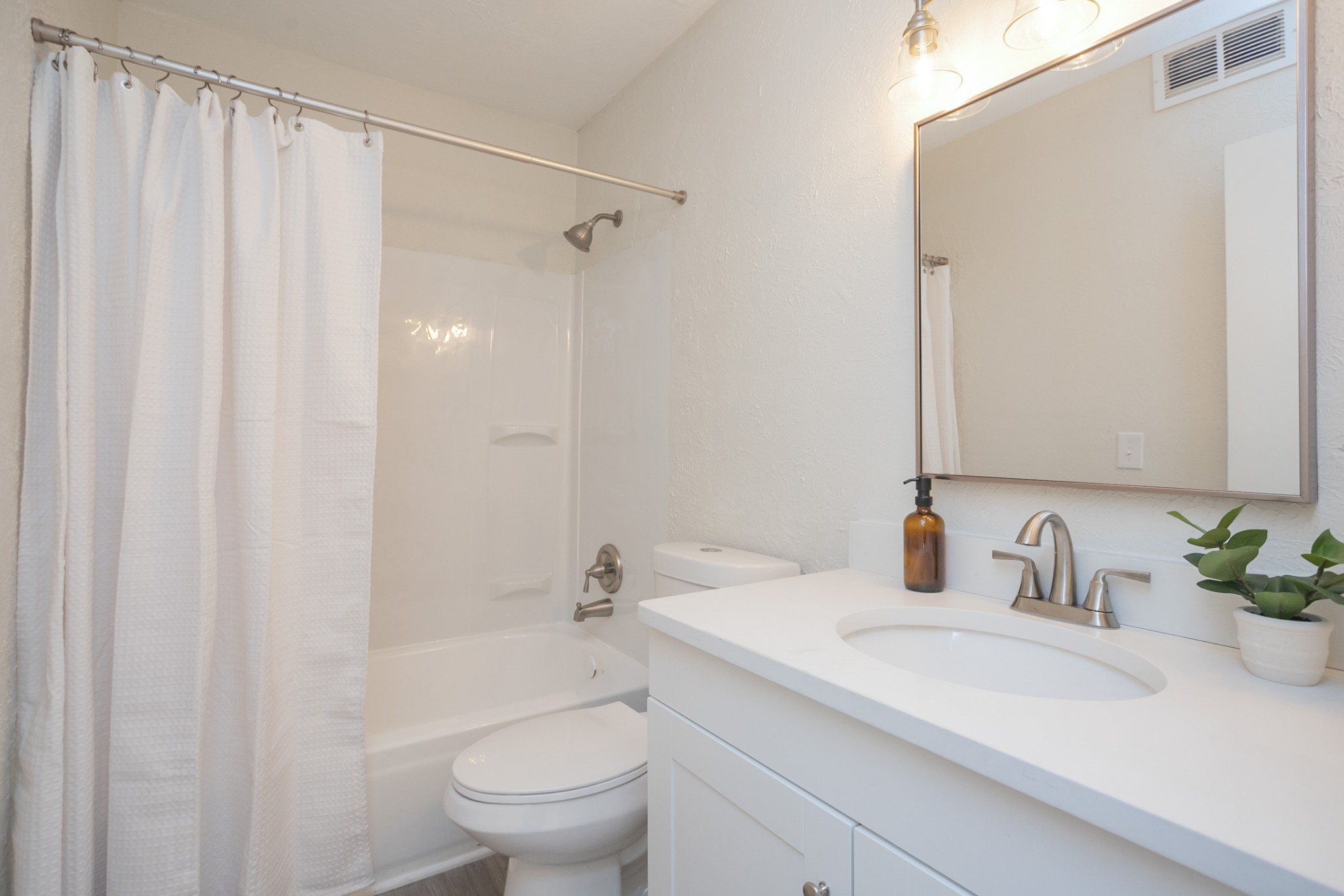 810 Bellevue Road, Unit 214 Nashville, TN 37221 - Photo 16 of 27 a bathroom with a sink a toilet and shower