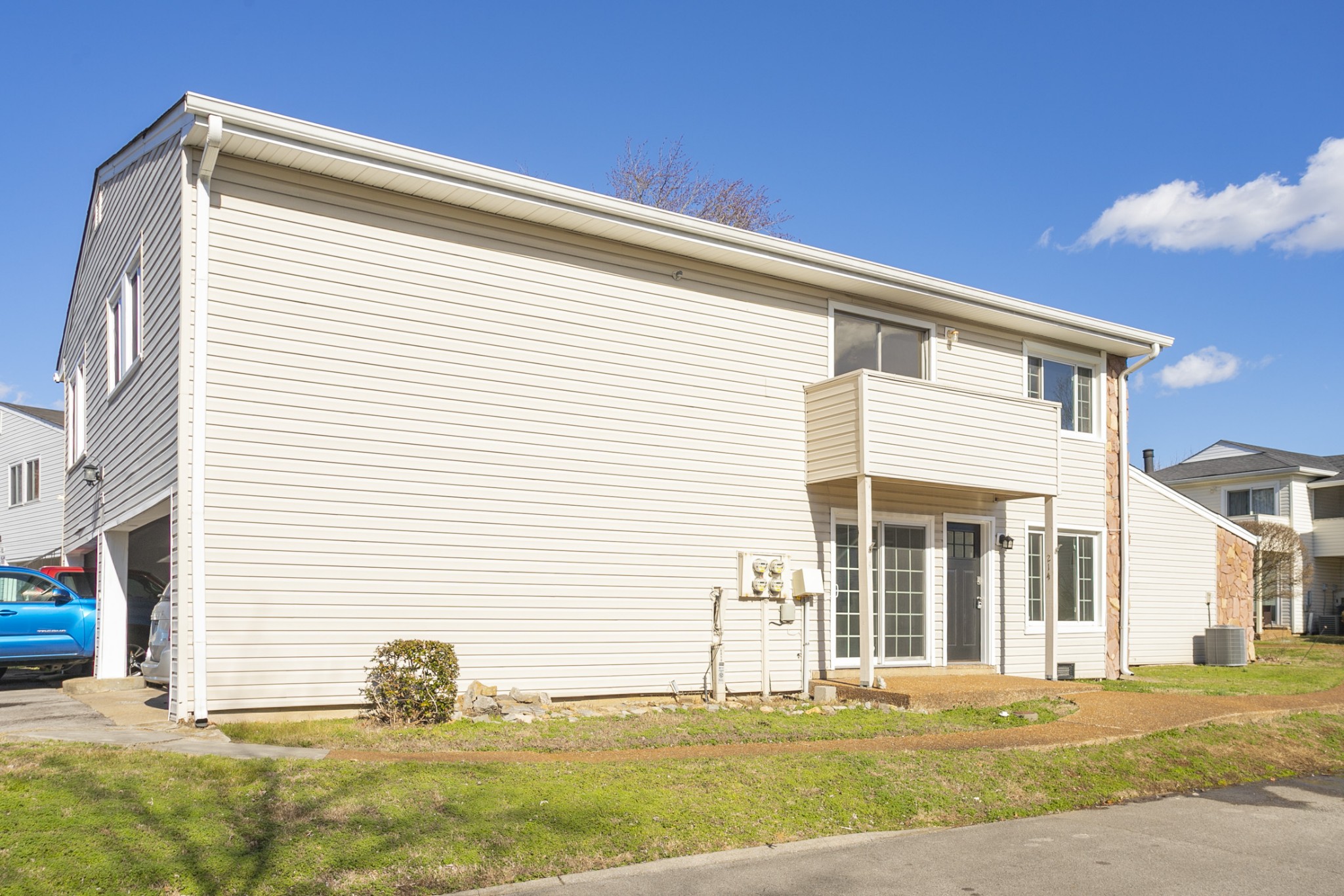 810 Bellevue Road, Unit 214 Nashville, TN 37221 - Photo 22 of 27 a front view of a house with a yard